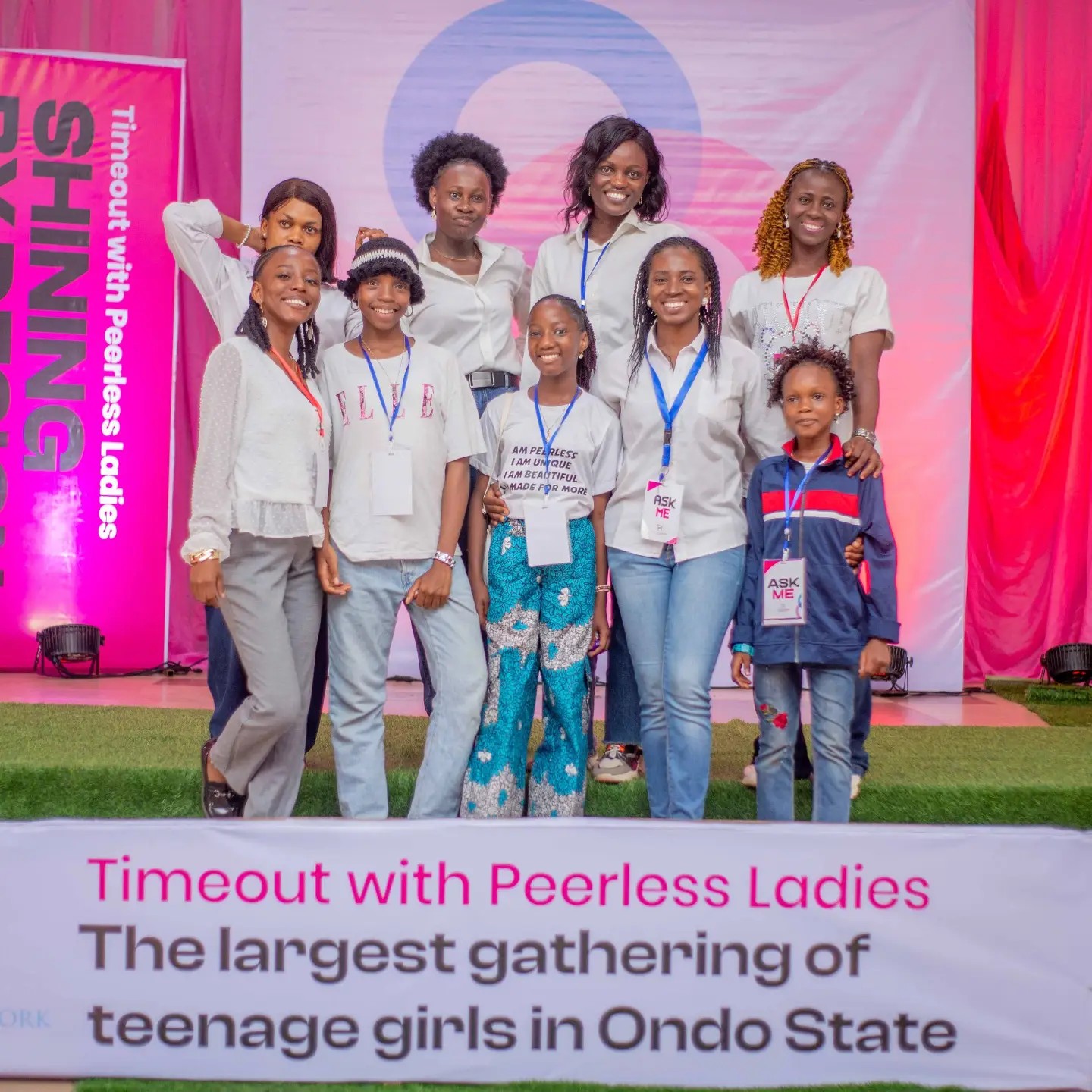 Girls and mentors standing together at the Peerless conference