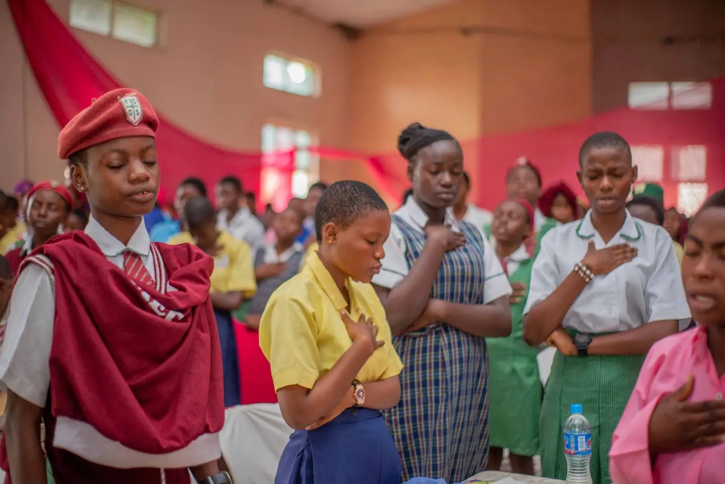 Secondary-school girls speaking together during a Peerless Network gathering