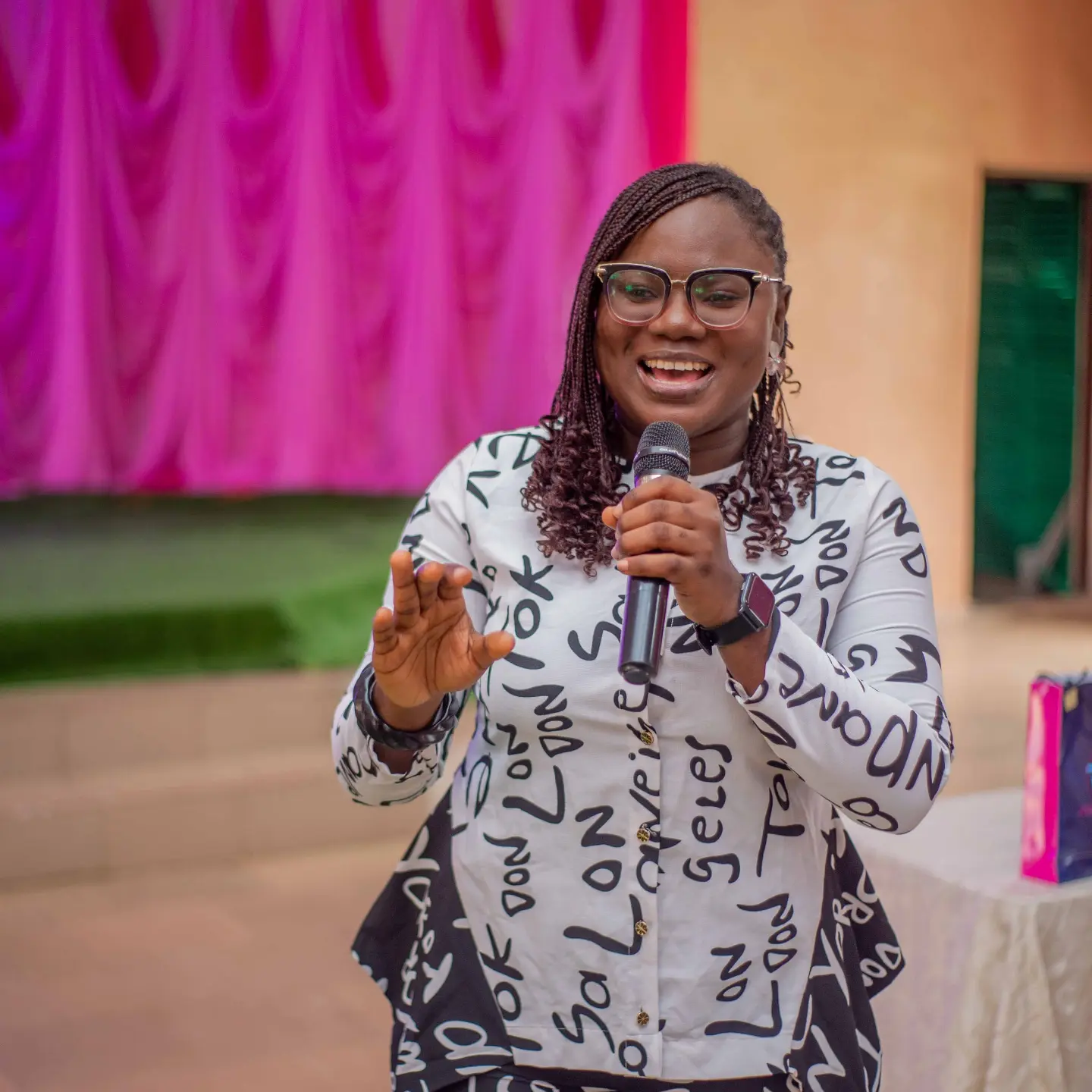 Peerless Network founder Olajumoke Ajayi speaking into a microphone